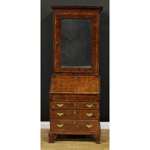 1361 - An 18th century burr yew bureau book cabinet, moulded cornice above a mirrored door enclosing a shel... 