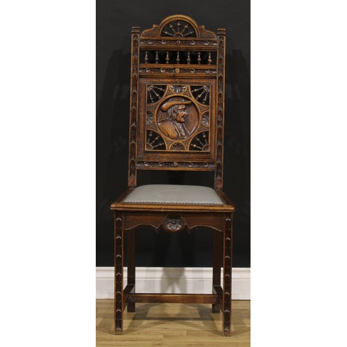 1348 - A set of six French Arts & Crafts period oak dining chairs, in the Henry II taste, each back carved ... 