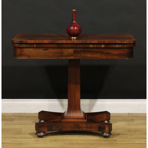 1876 - A William IV rosewood card table, hinged top enclosing a baize lined playing surface, spreading squa... 