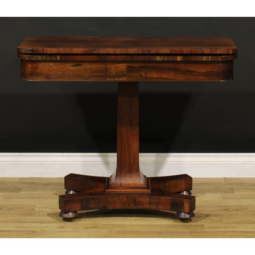 1876 - A William IV rosewood card table, hinged top enclosing a baize lined playing surface, spreading squa... 