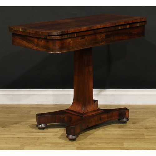 1876 - A William IV rosewood card table, hinged top enclosing a baize lined playing surface, spreading squa... 