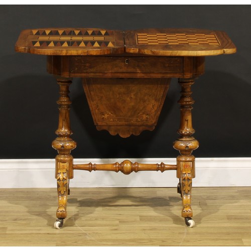 1869 - A Victorian walnut combination work and games table, hinged top enclosing parquetry fields inlaid fo... 