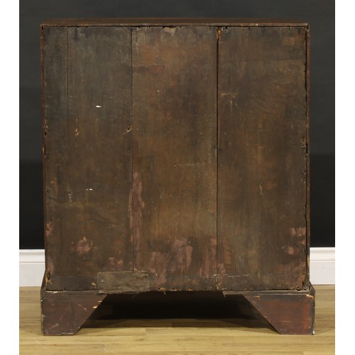 1188 - A George III oak bureau, fall front enclosing a well, a small door, small drawers and pigeonholes, a... 