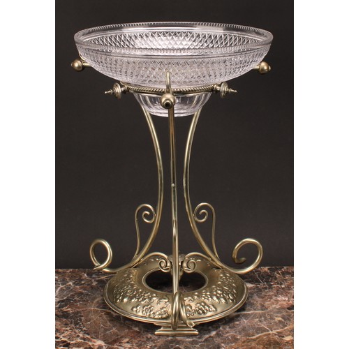 574 - An early 20th century E.P.N.S table centrepiece epergne, hobnail-cut glass bowl above three scrolls,... 