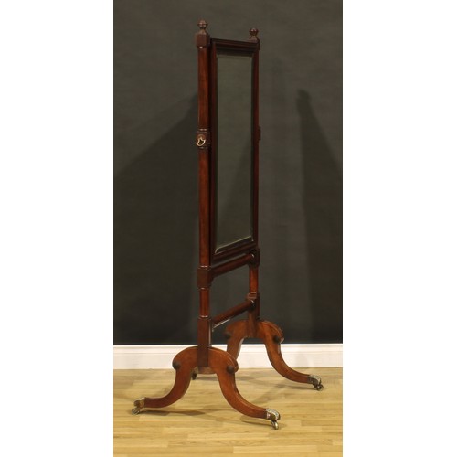 1424 - A Regency mahogany cheval mirror, bevelled plate, moulded frame, turned finials, hipped sabre legs, ... 