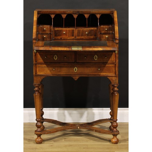 1453 - A William & Mary featherbanded walnut bureau, fall front enclosing a well, inset writing surface, sm... 