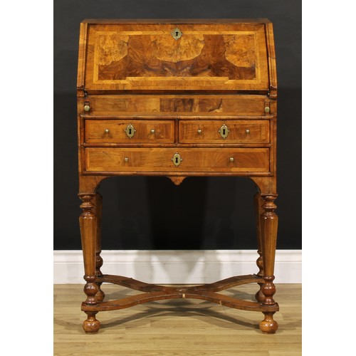 1453 - A William & Mary featherbanded walnut bureau, fall front enclosing a well, inset writing surface, sm... 