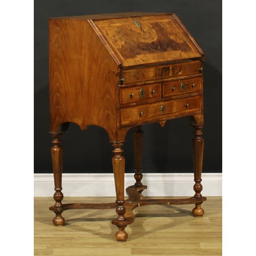 1453 - A William & Mary featherbanded walnut bureau, fall front enclosing a well, inset writing surface, sm... 