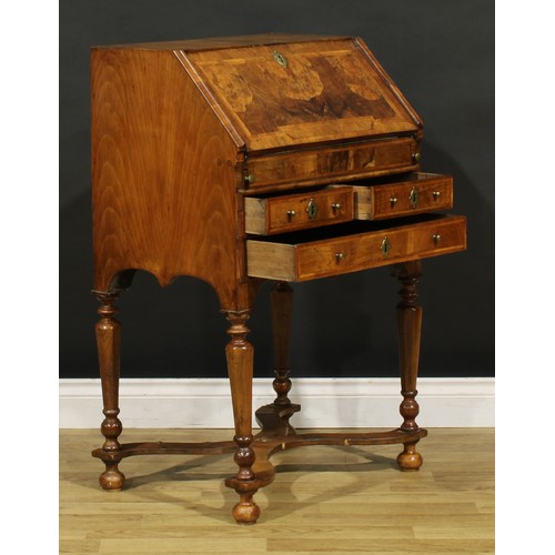 1453 - A William & Mary featherbanded walnut bureau, fall front enclosing a well, inset writing surface, sm... 