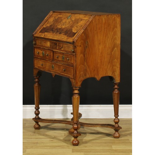 1453 - A William & Mary featherbanded walnut bureau, fall front enclosing a well, inset writing surface, sm... 