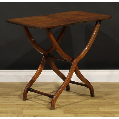 1395 - A 19th century mahogany folding coaching table, rounded rectangular top, shaped chamfered legs, turn... 