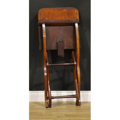 1395 - A 19th century mahogany folding coaching table, rounded rectangular top, shaped chamfered legs, turn... 