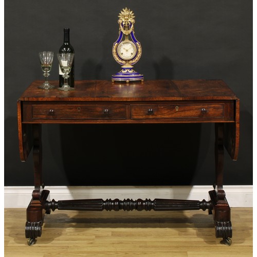 1207 - A George IV rosewood sofa table, in the manner of Gillows of Lancaster and London, crossbanded round... 