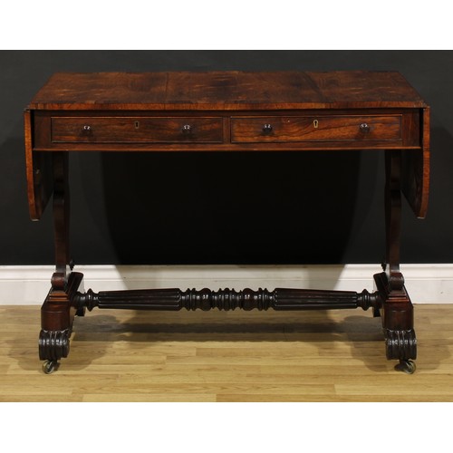 1207 - A George IV rosewood sofa table, in the manner of Gillows of Lancaster and London, crossbanded round... 