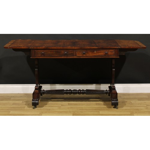 1207 - A George IV rosewood sofa table, in the manner of Gillows of Lancaster and London, crossbanded round... 