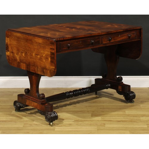 1207 - A George IV rosewood sofa table, in the manner of Gillows of Lancaster and London, crossbanded round... 