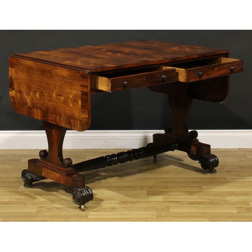 1207 - A George IV rosewood sofa table, in the manner of Gillows of Lancaster and London, crossbanded round... 