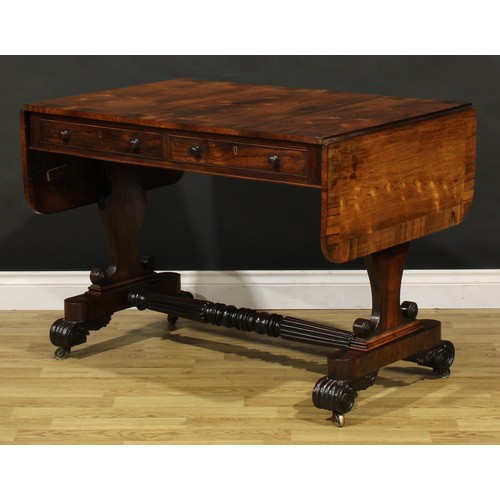 1207 - A George IV rosewood sofa table, in the manner of Gillows of Lancaster and London, crossbanded round... 