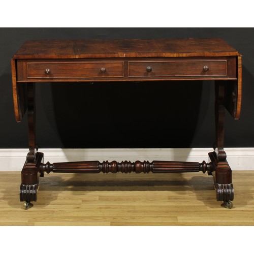 1207 - A George IV rosewood sofa table, in the manner of Gillows of Lancaster and London, crossbanded round... 