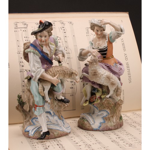 142 - A pair of 19th century porcelain figures, of a shepherd and shepherdess, decorated in polychrome, bo... 