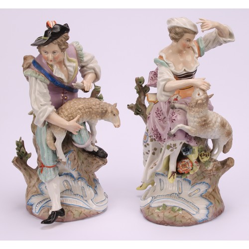 142 - A pair of 19th century porcelain figures, of a shepherd and shepherdess, decorated in polychrome, bo... 