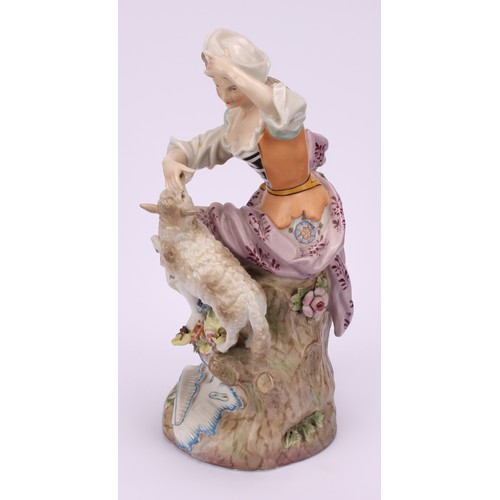 142 - A pair of 19th century porcelain figures, of a shepherd and shepherdess, decorated in polychrome, bo... 