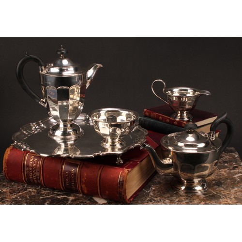 602 - A composed silver four piece tea service, Edward Viner, Sheffield 1930/1938; a silver shaped circula... 