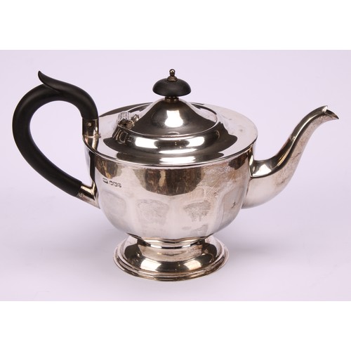 602 - A composed silver four piece tea service, Edward Viner, Sheffield 1930/1938; a silver shaped circula... 