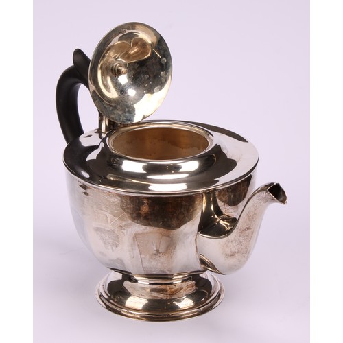 602 - A composed silver four piece tea service, Edward Viner, Sheffield 1930/1938; a silver shaped circula... 