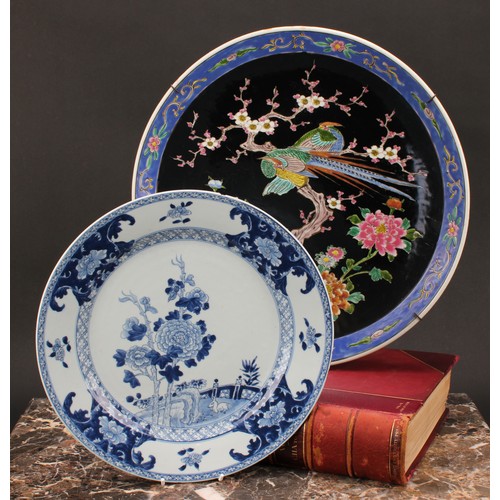 272 - An 18th century Chinese circular plate, decorated in underglaze blue with rabbit in fenced garden, 3... 