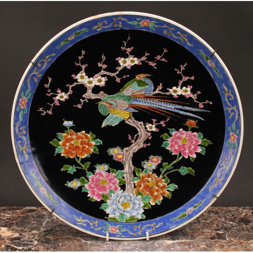 272 - An 18th century Chinese circular plate, decorated in underglaze blue with rabbit in fenced garden, 3... 