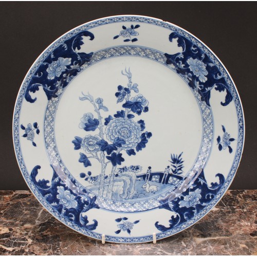 272 - An 18th century Chinese circular plate, decorated in underglaze blue with rabbit in fenced garden, 3... 