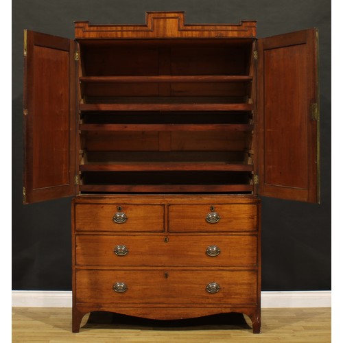 1327 - A George IV mahogany linen press, podium-shaped cornice above a pair of panel doors enclosing a shel... 