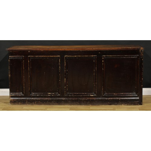 1438 - A Victorian mahogany and pine haberdashery shop counter, rectangular top above an arrangement of dra... 