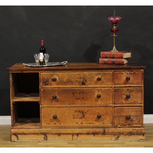 1437 - A Victorian mahogany and pine haberdashery shop counter, rectangular top above an arrangement of dra... 