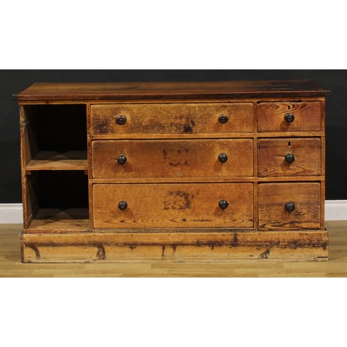 1437 - A Victorian mahogany and pine haberdashery shop counter, rectangular top above an arrangement of dra... 