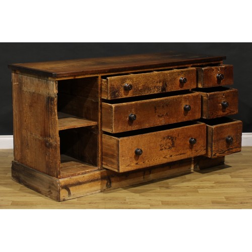 1437 - A Victorian mahogany and pine haberdashery shop counter, rectangular top above an arrangement of dra... 