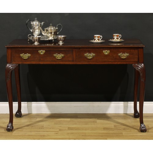 1404 - A George III Revival mahogany side or serving table, possibly Irish, moulded top above a pair of fri... 