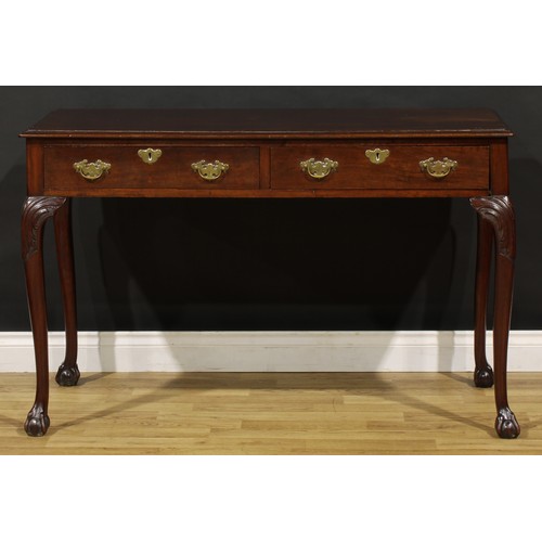 1404 - A George III Revival mahogany side or serving table, possibly Irish, moulded top above a pair of fri... 