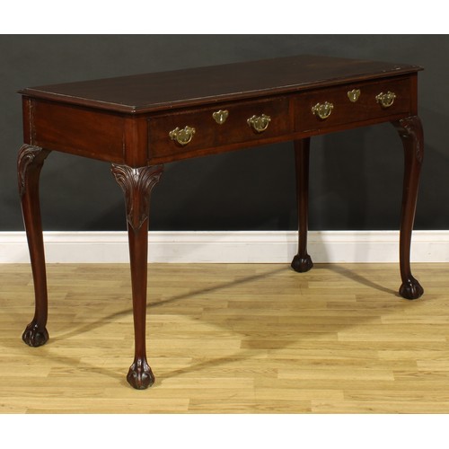 1404 - A George III Revival mahogany side or serving table, possibly Irish, moulded top above a pair of fri... 