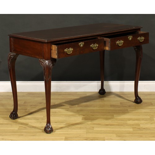 1404 - A George III Revival mahogany side or serving table, possibly Irish, moulded top above a pair of fri... 