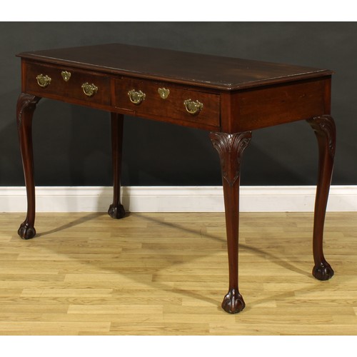 1404 - A George III Revival mahogany side or serving table, possibly Irish, moulded top above a pair of fri... 