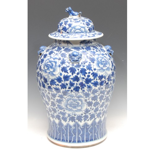 198 - A Chinese baluster temple jar and cover, painted in tones of underglaze blue with chrysanthemums, sc... 