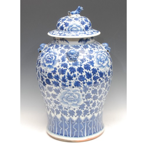 198 - A Chinese baluster temple jar and cover, painted in tones of underglaze blue with chrysanthemums, sc... 