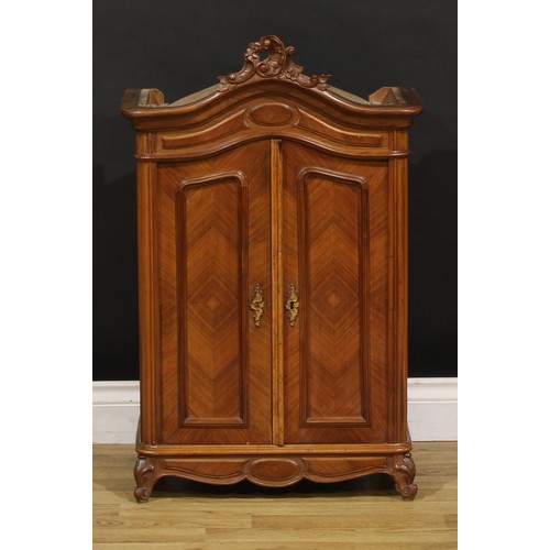 1941 - Miniature Furniture - a French Provincial walnut armoire, arched cresting carved with flowering C-sc... 