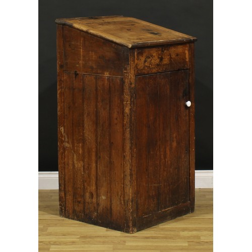 1199 - A late Victorian primitive vernacular pine porter’s or shopkeeper’s reception pedestal, hinged top a... 