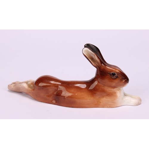 69 - A Royal Worcester model, of a Corgi, 9cm long, printed mark in black, shape 3243, date code for 1955... 