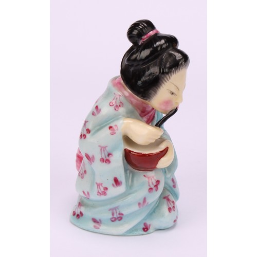 61 - A Royal Worcester candle snuffer, Japanese Geisha, painted in polychrome, wearing in a light blue ki... 