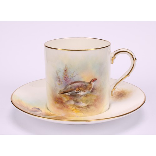 63 - A Royal Worcester coffee can and saucer, painted by P. Platts, signed, with Ptarmigan and Golden Plo... 