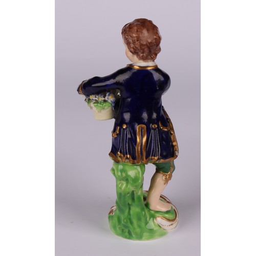 106 - A matched pair of Derby figures, Boy and Girl with Fruit and Flowers, he stands holding a basket of ... 